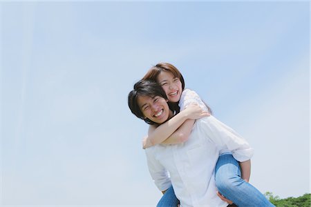 simsearch:841-02720357,k - Man giving Piggyback Ride to his Wife Stock Photo - Rights-Managed, Code: 859-03782019