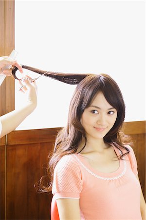 Young Woman taking Haircut in Beauty Salon Stock Photo - Rights-Managed, Code: 859-03782158