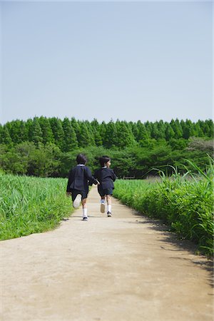 friends competing - Boys Running in Park Holding Hands Stock Photo - Rights-Managed, Code: 859-03782287