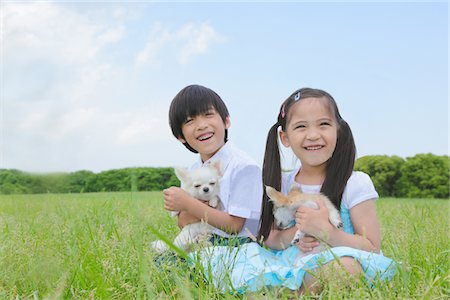 simsearch:649-06401393,k - Girl and Boy Sitting in Park with their Pets Stock Photo - Rights-Managed, Code: 859-03782393