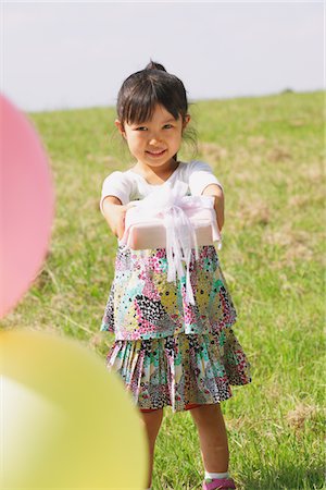 Girl Holding Present Stock Photo - Rights-Managed, Code: 859-03805855