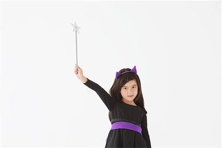 simsearch:859-03806258,k - Girl Dressed In Costume for Halloween Holding Magic Wand Foto de stock - Con derechos protegidos, Código: 859-03806262