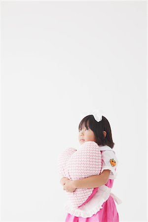 female silhouettes heart - Japanese Girl Holding Heart Stock Photo - Rights-Managed, Code: 859-03806334