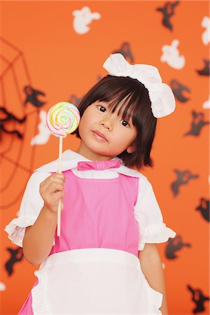 simsearch:6107-06117573,k - Japanese Girl Holding Lollypop Stock Photo - Rights-Managed, Code: 859-03806385