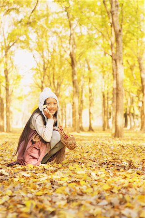 simsearch:859-03839388,k - Girl Playing In The Autumn Leaves Stock Photo - Rights-Managed, Code: 859-03839337