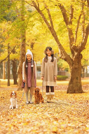 simsearch:859-03839388,k - Girls With Their Dogs In Autumn Foliage Stock Photo - Rights-Managed, Code: 859-03839387