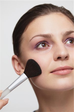 Young Woman Applying Makeup Stock Photo - Rights-Managed, Code: 859-03840023