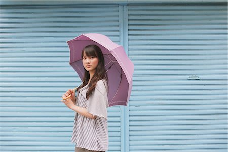 shutters - Young adult woman with umbrella Stock Photo - Rights-Managed, Code: 859-03840098