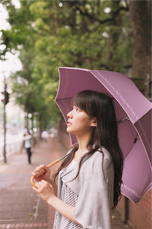 simsearch:859-03983201,k - Young adult woman with umbrella Stock Photo - Rights-Managed, Code: 859-03840106