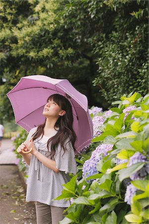 simsearch:859-03983201,k - Young adult woman with umbrella Stock Photo - Rights-Managed, Code: 859-03840134