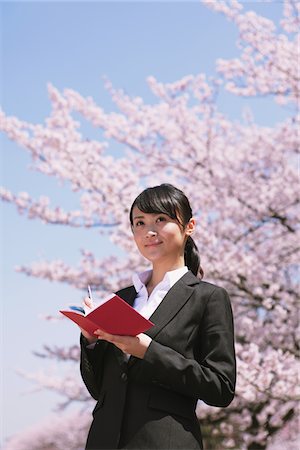 simsearch:859-06380299,k - Businesswoman in Front of Cherry blossoms Stock Photo - Rights-Managed, Code: 859-03840235