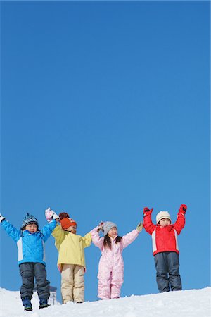 simsearch:614-07194495,k - Children Standing On Snow With Arm Raised Stock Photo - Rights-Managed, Code: 859-03840591