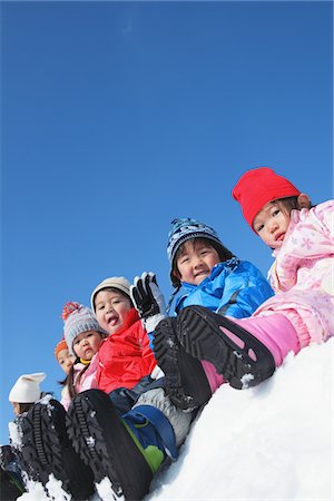 simsearch:614-07194495,k - Children Sitting Together In Snow Stock Photo - Rights-Managed, Code: 859-03840602