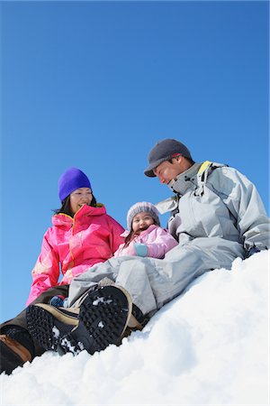 simsearch:859-03840695,k - Parents With Their Daughter Sitting And Having Fun In The Snow Stock Photo - Rights-Managed, Code: 859-03840628