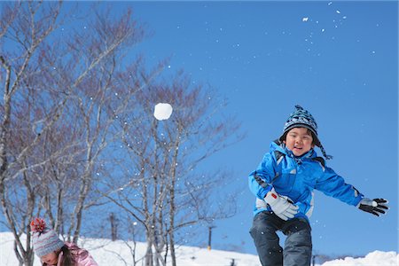 snow ball - Boy Throwing Snow Ball Stock Photo - Rights-Managed, Code: 859-03840676