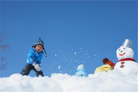 simsearch:859-03840695,k - Boy Throwing Snow Ball Stock Photo - Rights-Managed, Code: 859-03840677