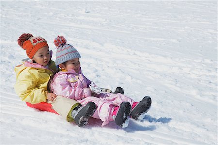 simsearch:859-03840695,k - Small Sisters Sledging In Snow Stock Photo - Rights-Managed, Code: 859-03840699