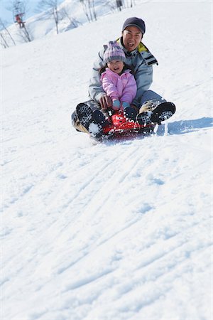 simsearch:859-03840695,k - Father And Daughter sledging In Snow Stock Photo - Rights-Managed, Code: 859-03840703