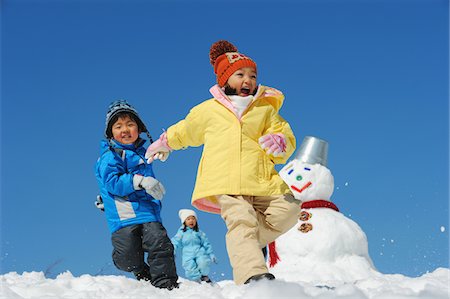 Children Running In Snow Stock Photo - Rights-Managed, Code: 859-03840987