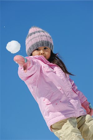 snow ball - Small Girl Throwing Snowball Stock Photo - Rights-Managed, Code: 859-03840980