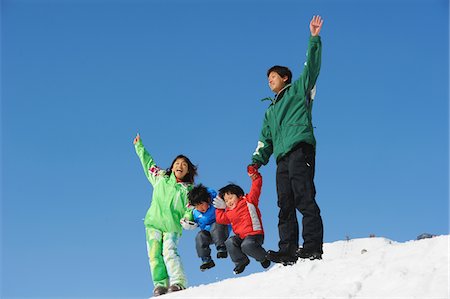simsearch:859-03840695,k - Family Having Fun In The Snow, Jumping Stock Photo - Rights-Managed, Code: 859-03841017