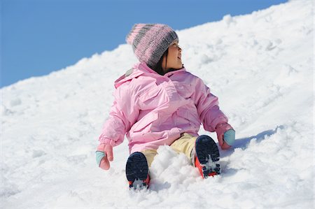 simsearch:859-03840695,k - Small Girl Sliding Downward In Snow Stock Photo - Rights-Managed, Code: 859-03841021