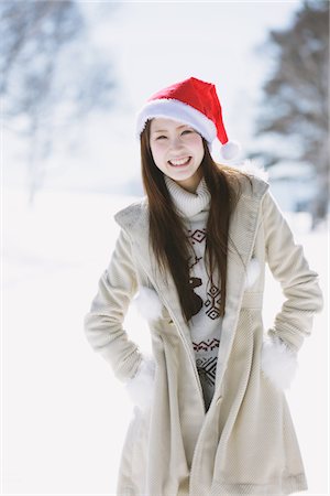 santa claus hat - Teenage Girl Posing In Snow Wearing Santa Hat Stock Photo - Rights-Managed, Code: 859-03860643