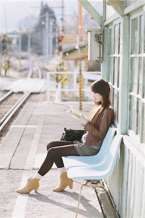 people waiting at train station - Pretty Young Woman At Train Station Reading Book Stock Photo - Rights-Managed, Code: 859-03860695