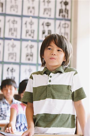 Japanese Schoolboy Answering In Classroom Stock Photo - Rights-Managed, Code: 859-03860774