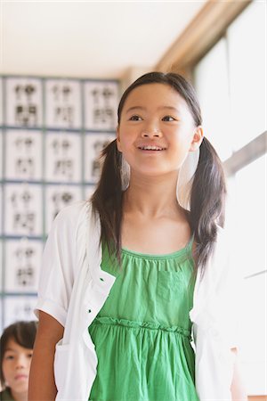 Schoolgirl Answering In Classroom Stock Photo - Rights-Managed, Code: 859-03860771