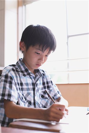 school boys side - Japanese Boy Writing In Notebook Stock Photo - Rights-Managed, Code: 859-03860790
