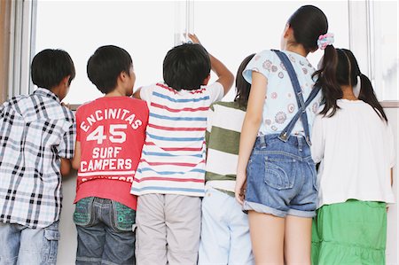 Children Looking Out Through A Window Stock Photo - Rights-Managed, Code: 859-03860866