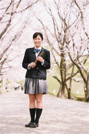 simsearch:859-06380209,k - High School Girl Standing On Pathway With Cherry Blossoms In Background Stock Photo - Rights-Managed, Code: 859-03884980
