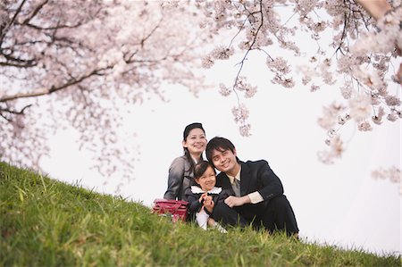 Japanese Family Having Fun In Meadow Stock Photo - Rights-Managed, Code: 859-03885003