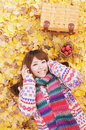 Japanese Women Lying On Ginkgo Leaves Stock Photo - Rights-Managed, Code: 859-03885463