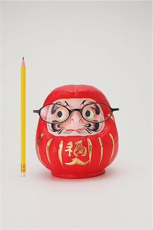 Traditional Japanese Daruma Doll Wearing Eyeglasses Stock Photo - Rights-Managed, Code: 859-03982392