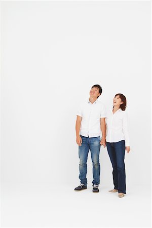 Japanese Couple Holding Hands And Looking Up Stock Photo - Rights-Managed, Code: 859-03982457