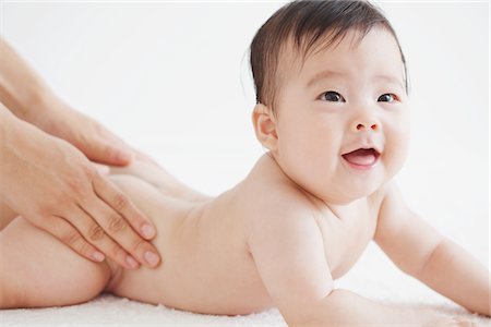 Mother Massaging Baby Stock Photo - Rights-Managed, Code: 859-03982758