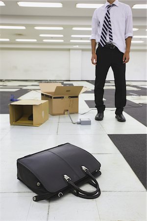 simsearch:859-03983026,k - Businessman Standing At Deserted Office Stock Photo - Rights-Managed, Code: 859-03983031