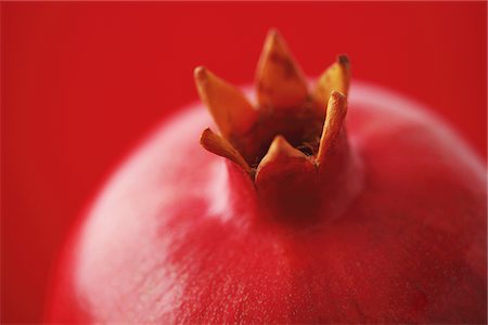 punica granatum - Close Up Of Pomegranate On Red Background Stock Photo - Rights-Managed, Code: 859-03983059