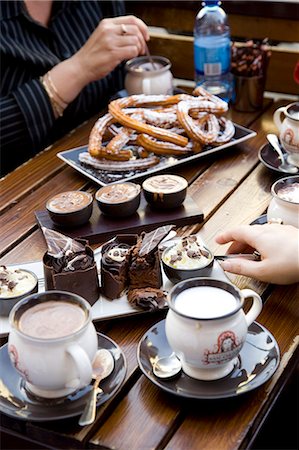 People eating cakes with coffee in cafe,close-up,Fitzroy/Brunswick Street areas,Melbourne,Australia Stock Photo - Rights-Managed, Code: 851-02958691