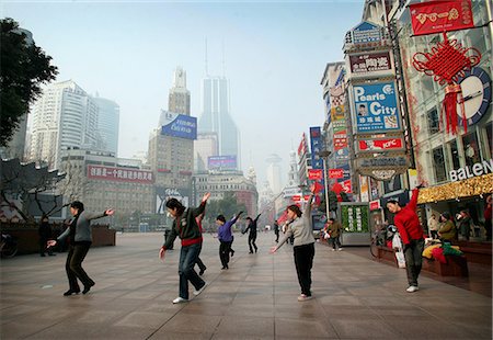 Chinese women doing dance and Tai Chi exercises in a shopping precinct,Shanghai,China Stock Photo - Rights-Managed, Code: 851-02959181