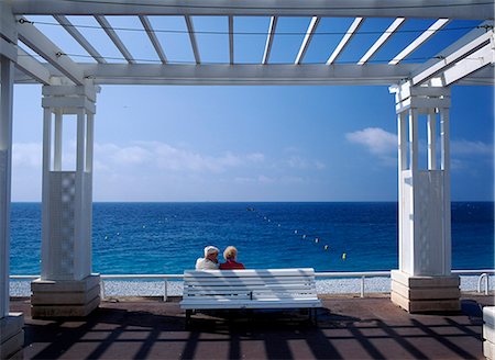 riviera - Old couple sitting on a bench on the promenade beside Nice beach,France. Stock Photo - Rights-Managed, Code: 851-02959935