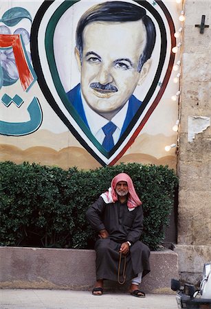 road painting image - Man sitting in front of painting,Aleppo,Syria Stock Photo - Rights-Managed, Code: 851-02962855