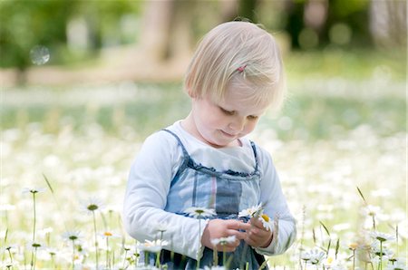 Blond girl on a flower meadow Stock Photo - Rights-Managed, Code: 853-05523496