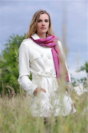 Young woman in white trench coat Stock Photo - Rights-Managed, Code: 853-05523801