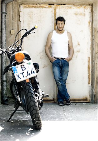 Man with motorbike Stock Photo - Rights-Managed, Code: 853-05840895