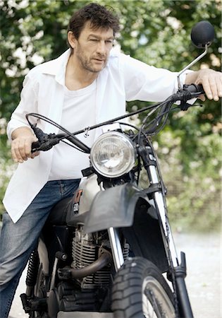 Man with motorbike Stock Photo - Rights-Managed, Code: 853-05840890