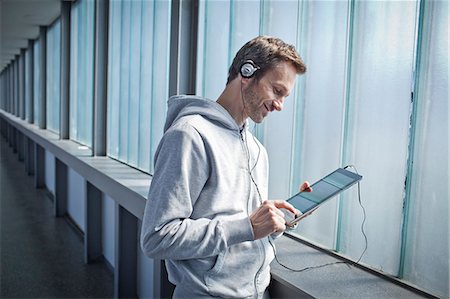 Man with ipad outdoors Stock Photo - Rights-Managed, Code: 853-06120407