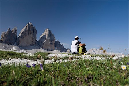 Hiker in front of Tre Cime di Lavaredo, Dolomites, South Tyrol, Italy Stock Photo - Rights-Managed, Code: 853-06120454